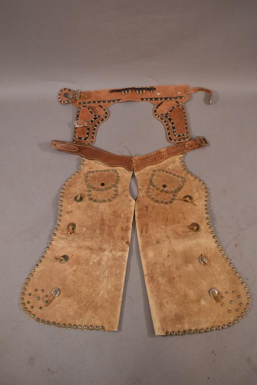 PAIR OF CHILDREN'S CHAPS & ROY ROGERS CAP GUN BELT: LEATHER CHILDREN'S CHAPS WITH SILVER STUD DECORATION. ROY ROGERS CAP GUN BELT.