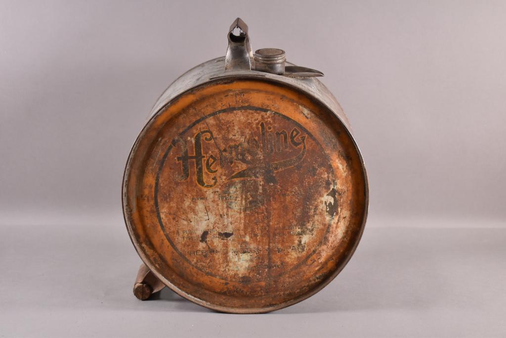 HERMOLINE ROCKER OIL CAN: EMPTY. WITH LID. HEAVILY RUSTED. PAINT LOSS.