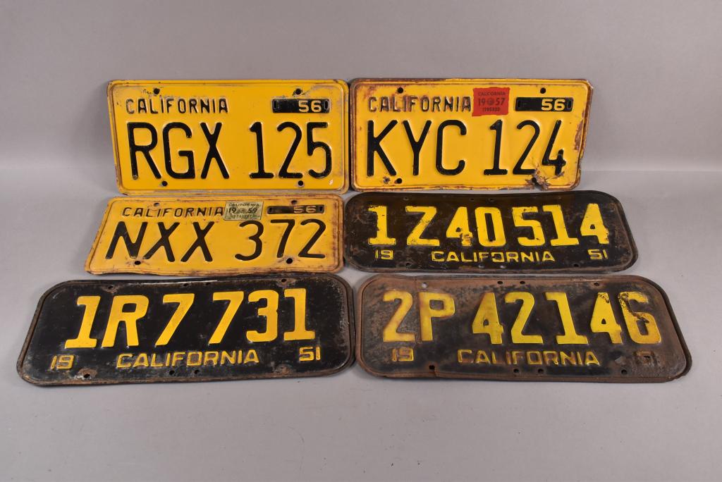 6 1950'S CALIFORNIA LICENSE PLATES: 3 1956, 3 1951. RUST, PAINT LOSS.