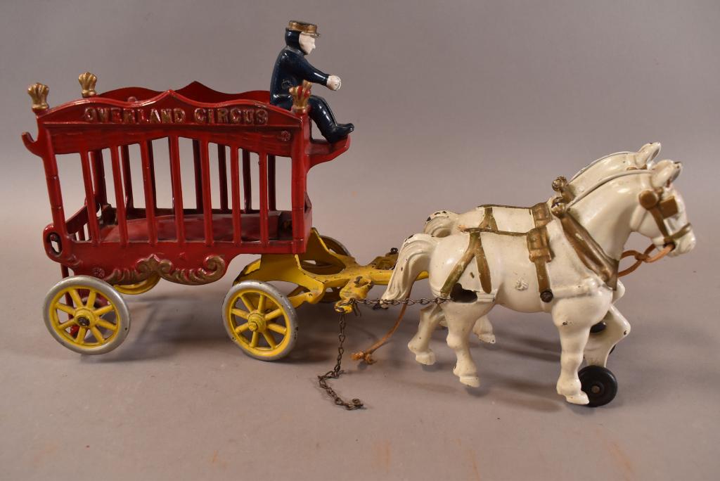 CAST IRON KENTON CIRCUS WAGON: MISSING ANIMAL THAT GOES INSIDE. 14" L. PAINT CHIPS AND LOSS.