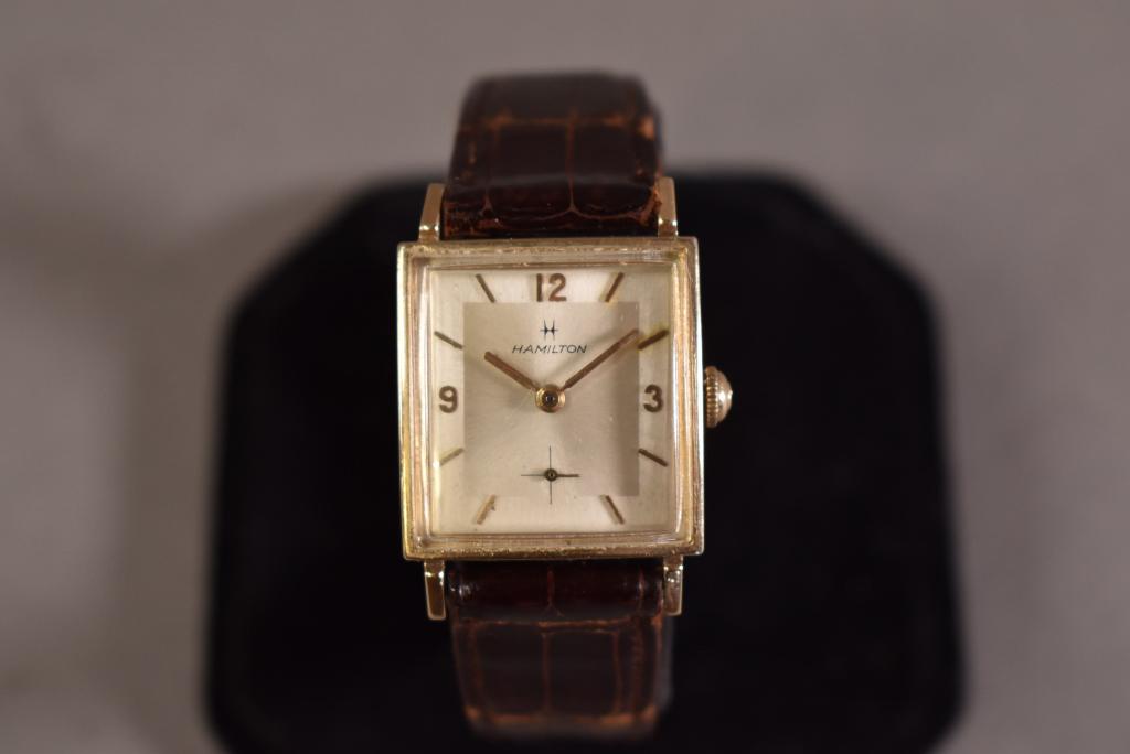 HAMILTON MENS 10 KT GOLD FILLED WRIST WATCH: 1950'S? INSCRIBED ON BACK. 28MM CASE INCLUDING CROWN. ALL WATCHES SOLD AS IS WE DO NOT GUARANTEE WORKING ORDER.