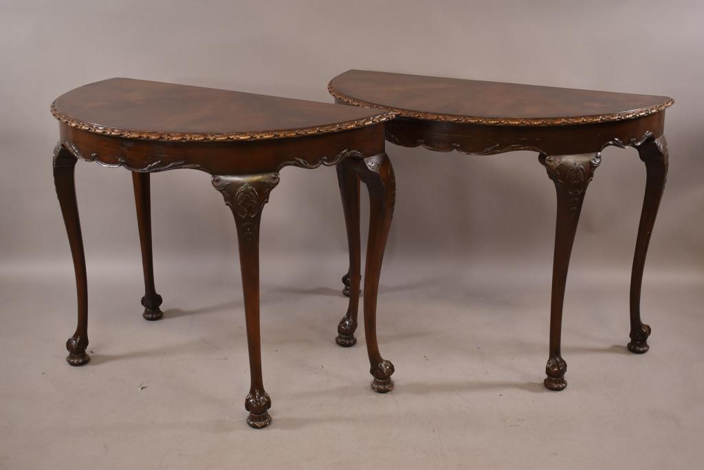 PAIR OF ANTIQUE MAHOGANY CONSOLE TABLES: FLAME MAHOGANY TOPS. CLAW AND BALL FOOT. OLD REFINISH. GOOD OVERALL CONDITION. 42" x 21" x 31 1/2" THIS ITEM EXCEEDS SIZE LIMITATIONS FOR IN HOUSE SHIPPING.