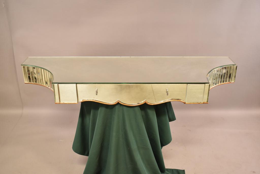 MIRRORED WALL MOUNT VANITY: SINGLE DRAWER FRONT. MIRRORED TOP. SOME WEAR TO MIRROR EDGES. 63" x 20". THIS ITEM EXCEEDS SIZE LIMITATIONS FOR IN HOUSE SHIPPING.