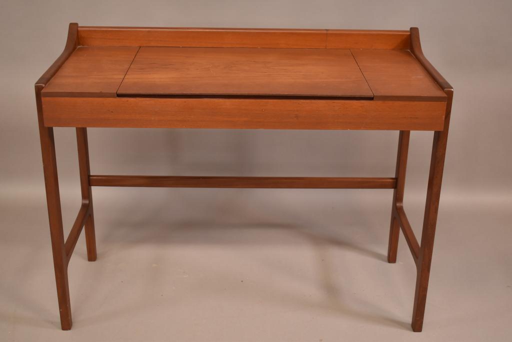 DANISH MODERN FLIP TOP VANITY: MISSING MIRROR ON INSIDE OF FLIP TOP. FINISH IN GOOD OVERALL CONDITION. 40" W x 17" D x 30" H. THIS ITEM EXCEEDS SIZE LIMITATIONS FOR IN HOUSE SHIPPING.