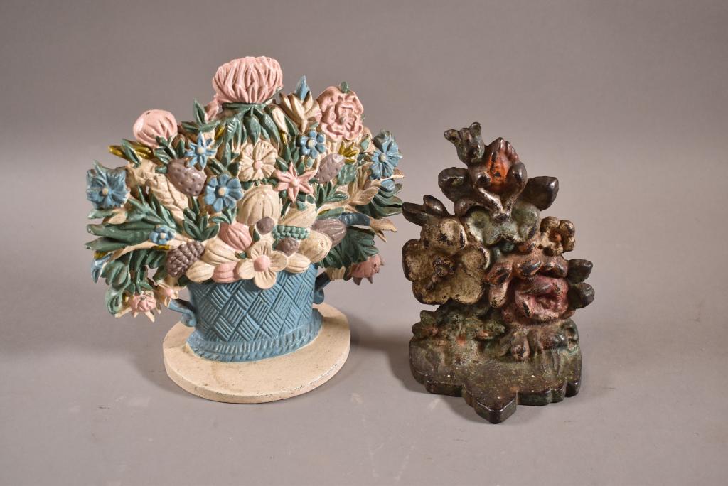 2 CAST IRON FLOWER DOORSTOPS (1 of 4)
