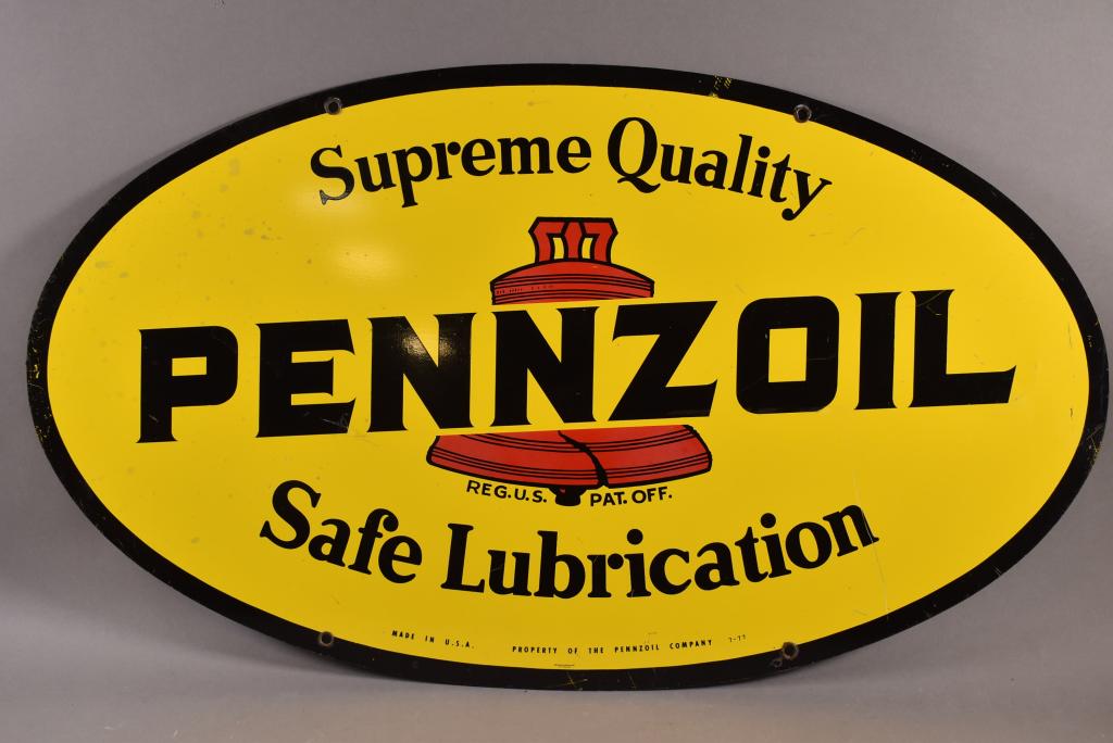 PENNZOIL TIN SIGN: DST SUPREME QUALITY SAFE LUBRICATION PENNZOIL SIGN. DATED 7-77. MINOR SURFACE SCRATCHES. 31" x 18"