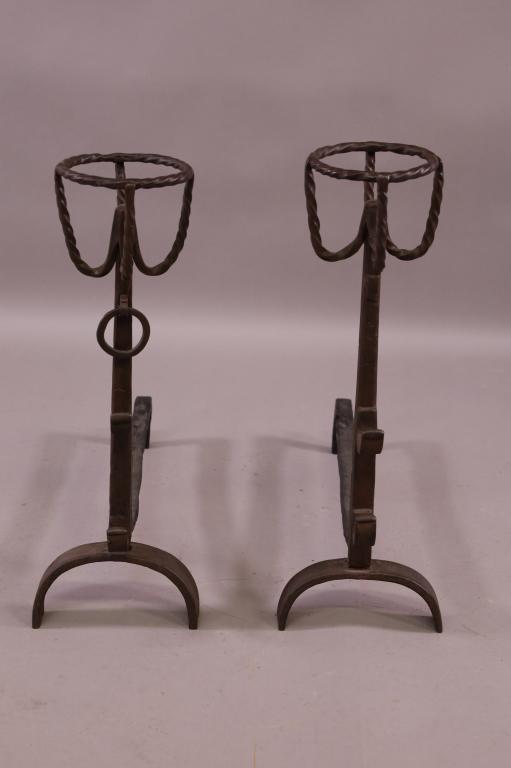PAIR TALL SPANISH STYLE ANDIRONS: GOOD CONDITION. 26" TALL X 28" LONG. MISSING RING. THIS ITEM EXCEEDS SIZE LIMITATIONS FOR IN HOUSE SHIPPING.