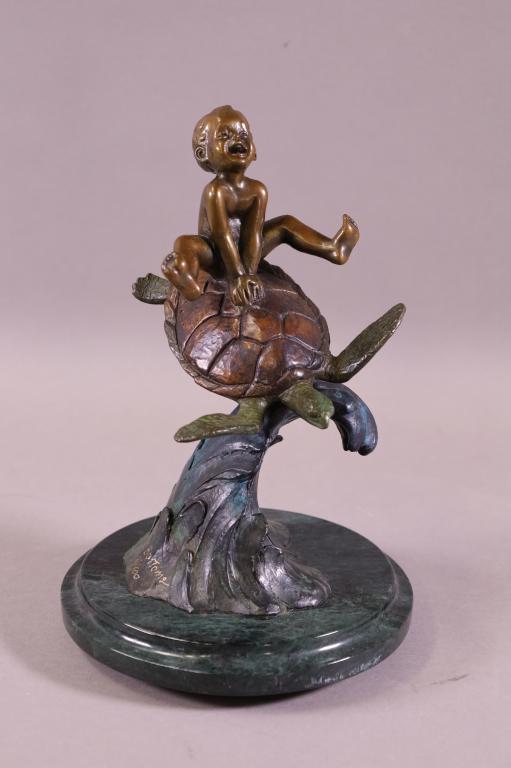 SMALL BRONZE CHILD REIDING SEA TURTLE STATUE (1 of 4)