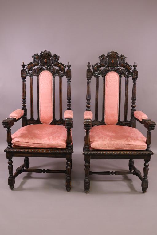 PAIR OF 1920'S LION CARVED HALL CHAIRS: TALL BACK LION CARVED ARM CHAIRS. NEWLY REUPHOLSTERED. GOOD OVERALL CONDITION. MINOR FINISH WEAR. 26" W x 25" D x 52" H. THIS ITEM EXCEEDS SIZE LIMITATIONS FOR IN HOUSE SHIPPING.