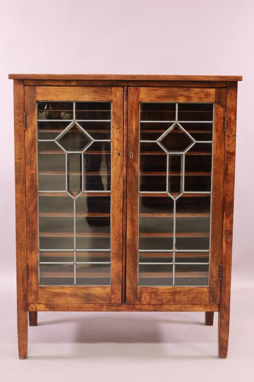 1900'S MAHOGANY LEADED DOOR MUSIC CABINET: 2 DOOR MUSIC CABINET WITH LEADED GLASS DOORS GOOD OVERALL CONDITION. NO KEY. 34" W x 17" D x 44" H . THIS ITEM EXCEEDS SIZE LIMITATIONS FOR IN HOUSE SHIPPING.