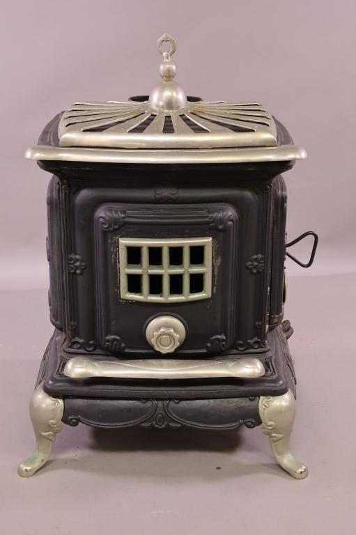 MODERN CAST IRON STOVE: MARKED ON BACK MADE IN TAIWAN. 26" W x 23" D x 38" H. THIS ITEM EXCEEDS SIZE LIMITATIONS FOR IN HOUSE SHIPPING.