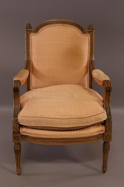 CARVED FRENCH ARM CHAIR: FRENCH STYLE CARVED ARMCHAIR. WEAR TO UPHOLSTERY ON ARMS. 25" W x 27" D x 39" H. THIS ITEM EXCEEDS SIZE LIMITATIONS FOR IN HOUSE SHIPPING.