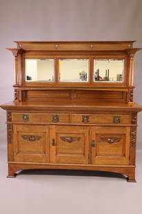 1900'S OAK SIDEBOARD W/ TRIPLE BEVELED MIRRORS: MIRRORED BACK ENGLISH OAK SIDE BOARD WITH 2 LOWER DOORS & 3 LOWER DRAWERS. CARVED FRUIT DECORATION. STAINS TO FINISH ON TOP SURFACE. AGE SPLIT TO BOTH ENDS. 71" W x 24" D x 73" H. THIS ITEM