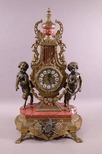 FRENCH STYLE MANTLE CLOCK: MARBLE & BRONZE FIGURAL MANTLE CLOCK WITH GERMAN WORKS. 24" H x 14" W. ALL CLOCKS ARE SOLD AS IS, WE DO NOT GUARANTEE WORKING ORDER. THIS ITEM EXCEEDS SIZE LIMITATIONS FOR IN HOUSE SHIPPING.