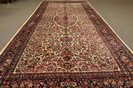 APPROX 19' x 9' HANDMADE PERSIAN RUG: NEEDS CLEANED, HAS STAINS. MOTH DAMAGE. THIS ITEM EXCEEDS SIZE LIMITATIONS FOR IN HOUSE SHIPPING.