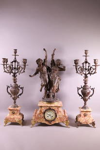 FRENCH 3 PIECE CLOCK SET: GILT METAL AND MARBLE 3 PIECE CLOCK SET. DANCING COUPLE FIGURES. 5 ARM CANDELABRAS SIDE PIECES. PORCELAIN DIAL CLOCK. "BANSEURS BASQUES" ONE CANDELABRA HAS BEEN REPAIRED. CHIPS TO MARBLE. 29" H.