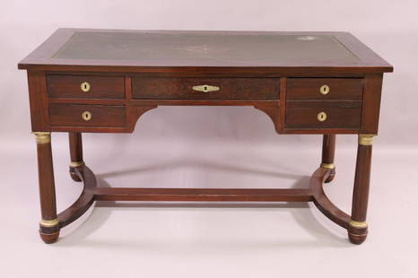 ANTIQUE EMPIRE STYLE LEATHER TOP DESK: MAHOGANY 4 DRAWER DESK. WITH KEY. STAINS TO TOP SURFACE, WEAR TO LEATHER TOP. 55" W x 32" D x 30" H . THIS ITEM EXCEEDS SIZE LIMITATIONS FOR IN HOUSE SHIPPING.