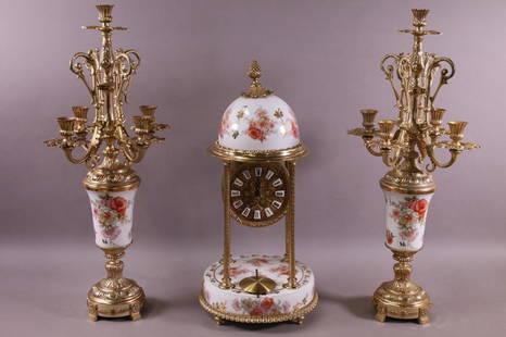 3 PIECE PORCELAIN & METAL CLOCK SET: GOLT GILT METAL AND PORCELAIN 3 PIECE CLOCK SET. ARTIST SIGNED "ROCALBA". CLOCK IS 19" H. BATTERY OP WORKS. ALL CLOCKS ARE SOLD AS IS WE DO NOT GUARANTEE WORKING ORDER. THIS ITEM EXCEEDS SIZE 