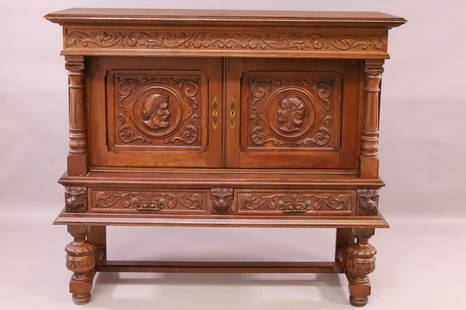 1900'S CARVED OAK EUROPEAN HALL CABINET: 2 DOOR, 2 DRAWER, 2 PART FIGURAL CARVED EUROPEAN OAK HALL CABINET. NO KEY. 55" W x 22" D x 47" H. THIS ITEM EXCEEDS SIZE LIMITATIONS FOR IN HOUSE SHIPPING.