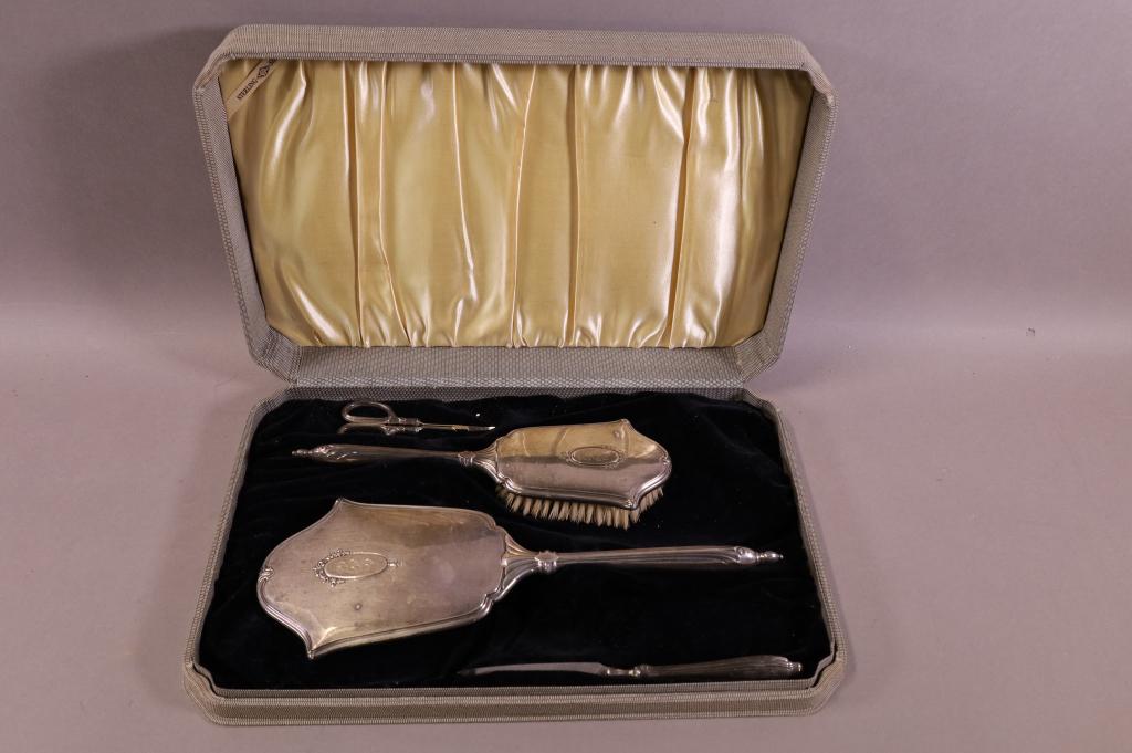 4 PIECE STERLING DRESSER SET: IN ORIGINAL CASE. MONOGRAMED. HAND MIRROR, BRUSH, SCISSORS & FILE. 4" - 13" L.
