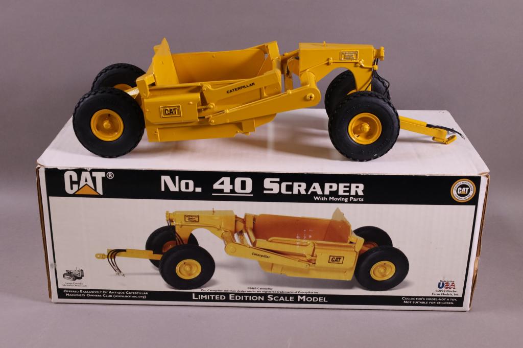 RIECKE FARM MODEL CATERPILLAR SCRAPER NO. 40: 1/25 SCALE OFFERED BY ACMOC. 16" L. HAS ORIGINAL BOX