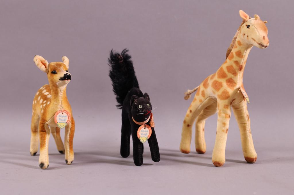 3 SMALL VINTAGE STEIFF ANIMALS: DEER, GIRAFFE, & BLACK CAT. ALL HAVE PAPER TAGS. GOOD CONDITION. 4 1/2" TO 6" H