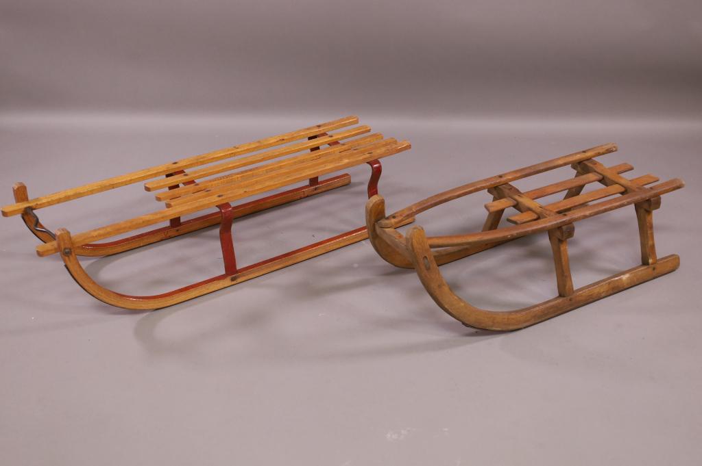 2 VINTAGE EUROPEAN SLEDS: ALL WOOD & WOOD AND METAL. ONE MARKED DADOS. 40" L & 33" L. THIS ITEM EXCEEDS SIZE LIMITATIONS FOR IN HOUSE SHIPPING.