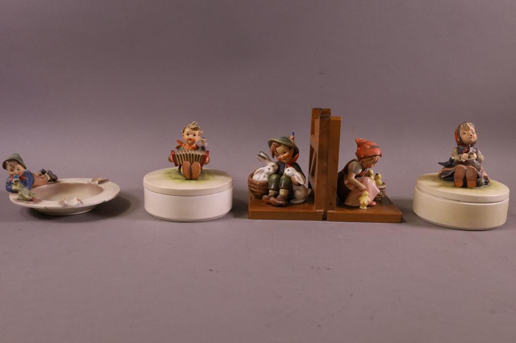 GROUPING OF HUMMEL ITEMS: ASHTRAY, BOOKENDS, & 2 COVERED JARS. GOOD CONDITION.