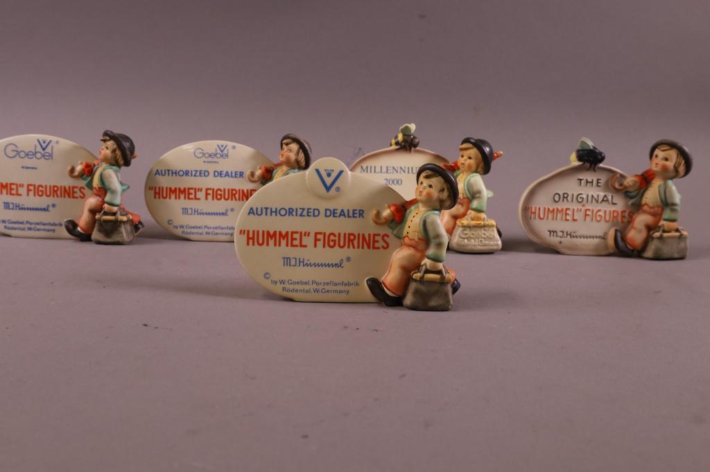 5 HUMMEL FIGURINE PLAQUES: AUTHORIZED DEALER, AND HUMMEL FIGURINE PLAQUES. CRAZING TO SOME. 3 1/2 " TALL X 6" WIDE