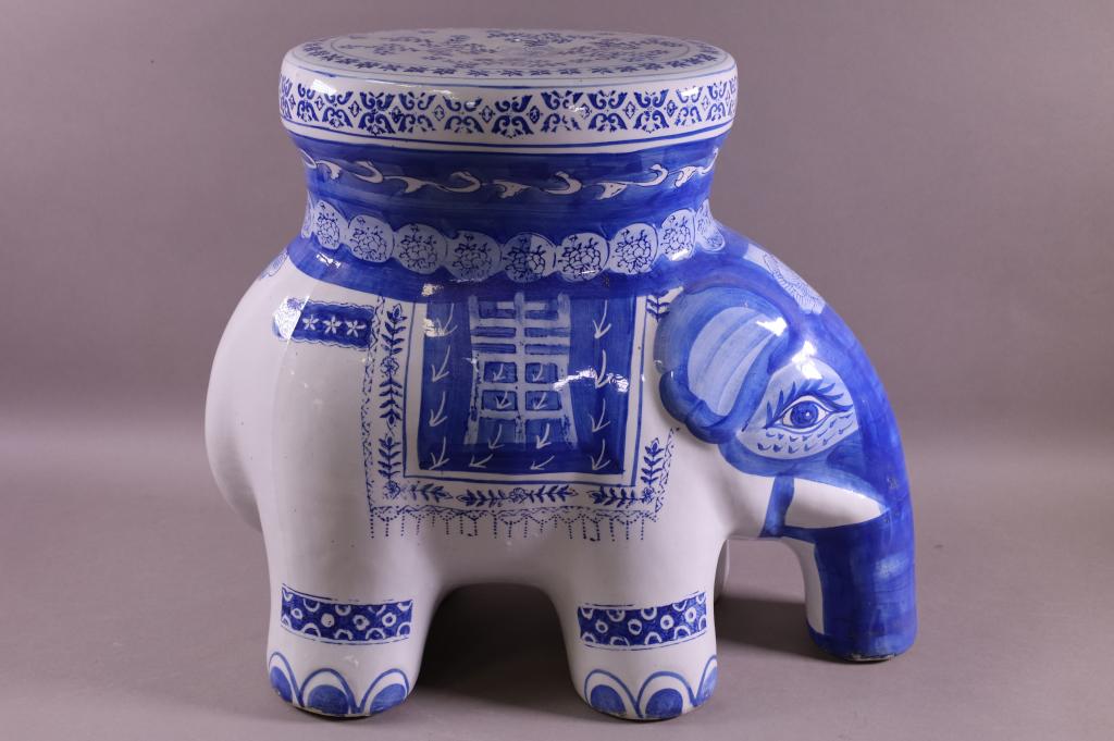 CHINESE ELEPHANT GARDEN SET: BLUE AND WHITE PORCELAIN ELEPHANT FORM GARDEN SEAT. GOOD CONDITION. 20" L x 17" H. THIS ITEM EXCEEDS SIZE LIMITATIONS FOR IN HOUSE SHIPPING.