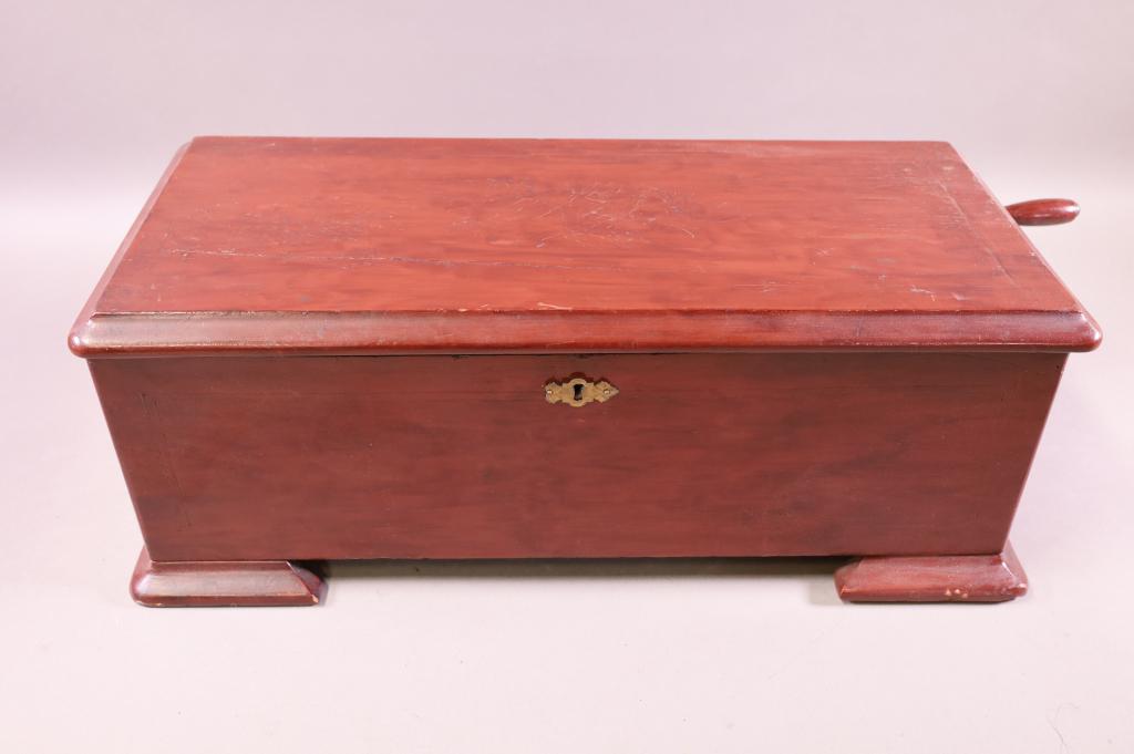 ANTIQUE SWISS MUSIC BOX: 10 SONG SWISS MUSIC BOX. SINGLE COMB, NO BROKEN TEETH. SURFACE SCRATCHES AND FINISH WEAR. WORKING. NO KEY. 21" W x 10" D x 8" H. THIS ITEM EXCEEDS SIZE LIMITATIONS FOR IN HOUSE SHIPPING.