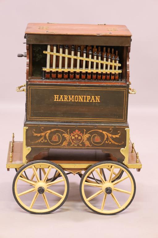 HARMONIPAN CRANK ORGAN: HARMONIPAN (KALLIOPE) (BARREL ORGAN) CRANK ORGAN, UNMARKED HOFBAUER STYLE. INLAID FRONT. ON CUSTOM ROLLING CART. WORKING. 19" W x 13" D x 23" H. THIS ITEM EXCEEDS SIZE LIMITATIONS FOR IN HOUSE SHIPPIN