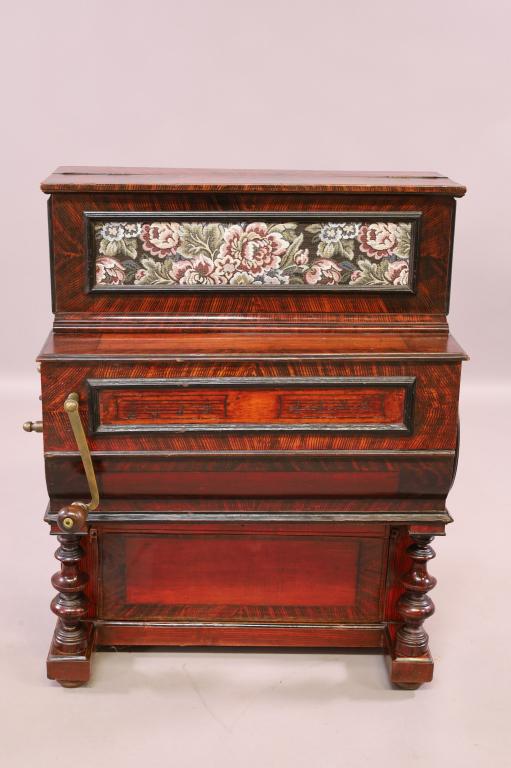 ISABELLO VELAZQUEZ CRANK ORGAN: 10 SONG DISC. ROSEWOOD AND FAUX PAINTED. HURDY-GURDY STYLE CRANK BARREL ORGAN. WORKING. 28" W x 18" D x 35" H. THIS ITEM EXCEEDS SIZE LIMITATIONS FOR IN HOUSE SHIPPING.