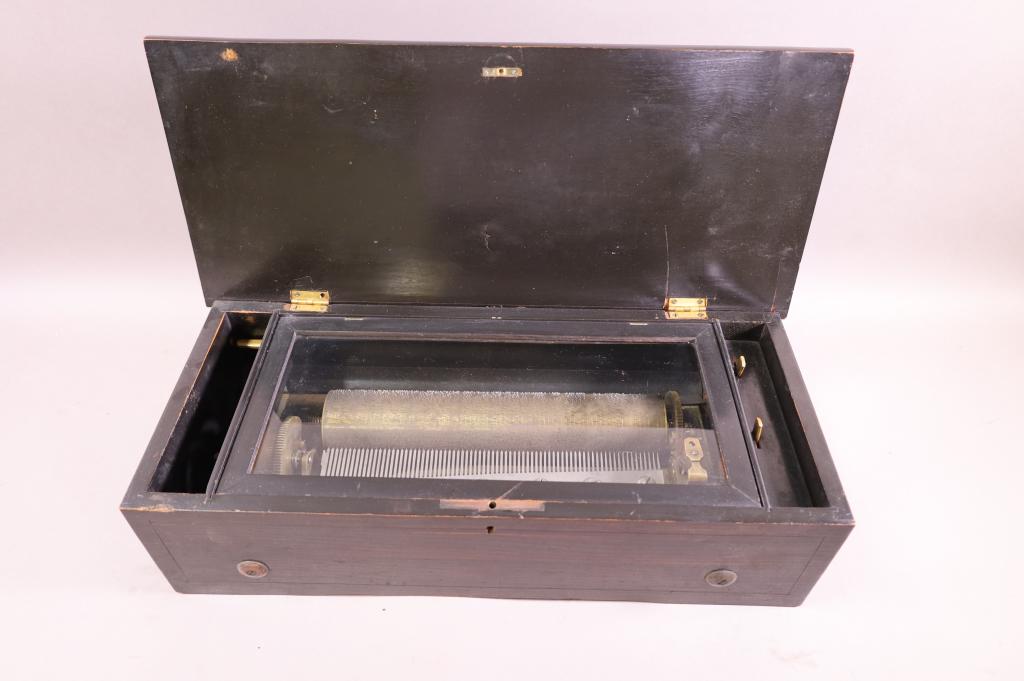 SWISS CYLINDER MUSIC BOX: SWISS CYLINDER MUSIC BOX, ROSEWOOD CASE, 11" CYLINDER, SINGLE COMB, NO KEY, GOOD CONDITION. WORKING. 20" W x 9" D x 5 1/2" H. THIS ITEM EXCEEDS SIZE LIMITATIONS FOR IN HOUSE SHIPPING.