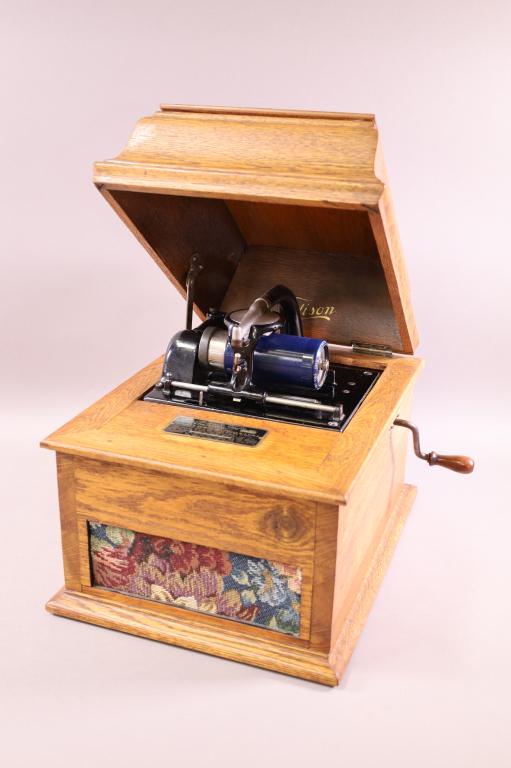 EDISON AMBEROLA CYLINDER PLAYER: EDISON AMBEROLA, MODEL 30, SER. 41132. REFINISHED CASE WITH MODERN FABRIC. HAS CRANK, WORKING. 16" W x 12" D x 13" H. THIS ITEM EXCEEDS SIZE LIMITATIONS FOR IN HOUSE SHIPPING.
