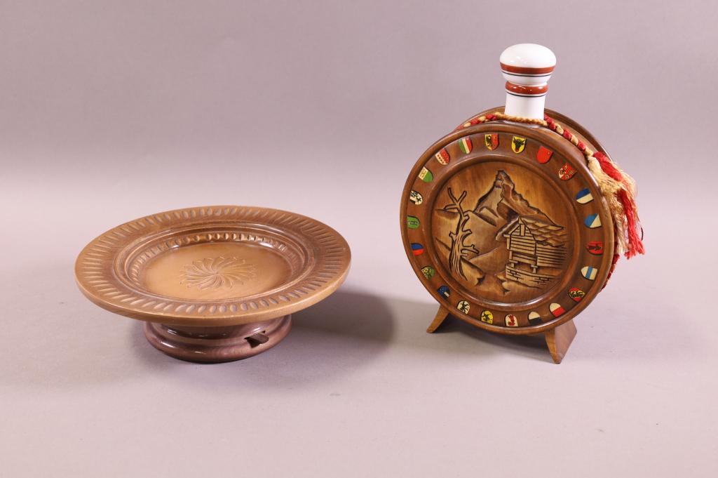 2 WOODEN MUSIC BOXES: WOODEN CANTEEN FORM MUSIC BOX, WITH PORCELAIN TOP, WORKING, 9" H. & ROTATING PLATTER MUSICAL, WORKING. 8 1/2" DIAM.
