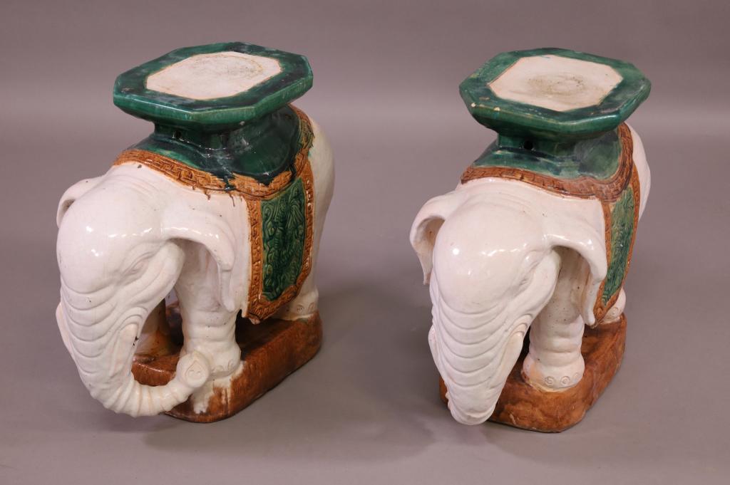 PAIR OF CHINESE PORCELAIN ELEPHANT GARDEN SEATS: PAIR OF ELEPHANT FORM PORCELAIN GARDEN SEATS. SOME CRACKS AND PAINT LOSS. 23" W x 19" H. THIS ITEM EXCEEDS SIZE LIMITATIONS FOR IN HOUSE SHIPPING.