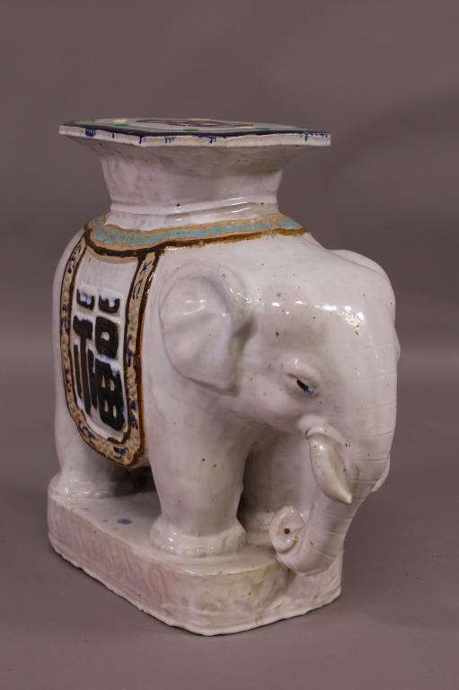 CHINESE PORCELAIN ELEPHANT GARDEN SEAT: ELEPHANT FORM PORCELAIN GARDEN SEAT. SOME CRACKS AND PAINT LOSS. 22" W x 21" H. THIS ITEM EXCEEDS SIZE LIMITATIONS FOR IN HOUSE SHIPPING.