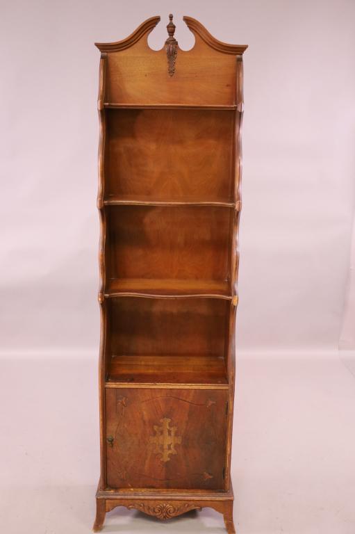 1930'S STEEPLE TOP BOOKCASE: 3 OPEN SHELVES, SINGLE LOWER DOOR. . MINOR FINISH WEAR. 19" W x 10" D x 67" H. THIS ITEM EXCEEDS SIZE LIMITATIONS FOR IN HOUSE SHIPPING.