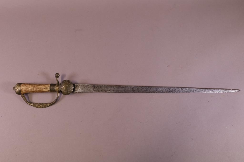 GERMAN HUNTING SWORD: STAG HANDELED GERMAN HUNTING SWORD. RABBIT DESIGN ON HILT. BLADE IS PITTED AND POSSIBLE ADDED. BLADE IS 20" L / 25" L