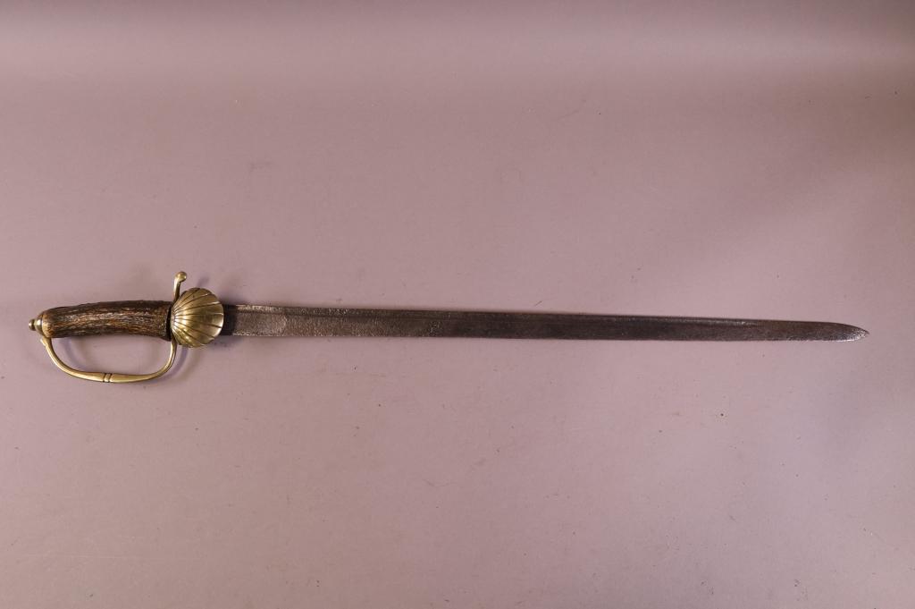 GERMAN HUNTING SWORD: STAG AND BRASS HANDLE AND GUARD. PITTED BLADE. BLADE IS 24" L / 29" L