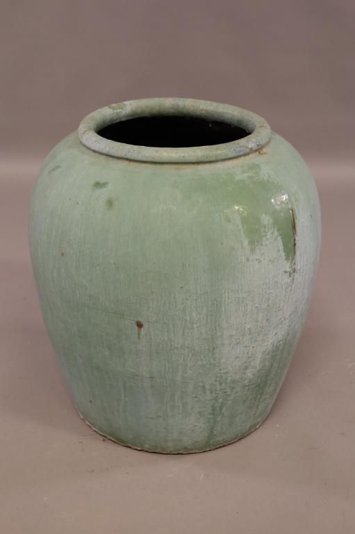 LARGE OUTDOOR POTTERY PLANTER: LARGE GREEN GLAZED OUTDOOR POTTERY PLANTER. GLADDING MCBEAN? 23" H x 12" DIAM. THIS ITEM EXCEEDS SIZE LIMITATIONS FOR IN HOUSE SHIPPING.