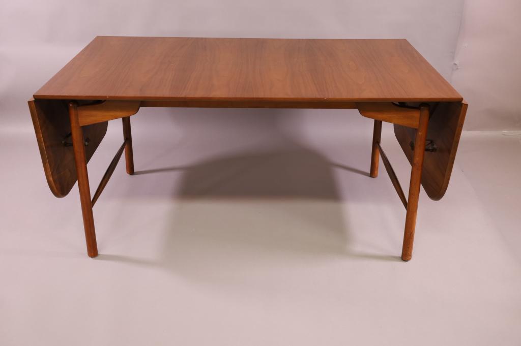 GRETA MAGNUSSON GROSSMANN DINING TABLE: DROP LEAF DINING TABLE. UNMARKED GRETA MAGNUSSON GROSSMANN. FINISH IN GOOD CONDITION, 60" L x 36" D x 28 1/2" H / 18" L DROP SIDE. THIS ITEM EXCEEDS SIZE LIMITATIONS FOR IN HOUSE SHIPPING.