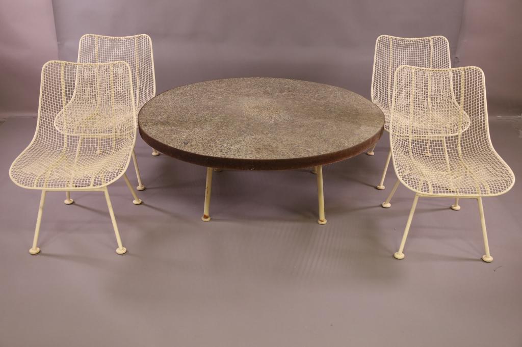 MID CENTURY RUSSELL WOODARD PATIO TABLE & 4 CHAIRS: RUSSELL WOODARD PATIO TABLE AND 4 CHAIRS, 4 LOW SIDE CHAIRS AND CONCRETE TOP ROUND TABLE. 48" DIAM x 19" H TABLE / 19 1/2" W x 24" D x 29" H. CHAIRS. THIS ITEM EXCEEDS SIZE LIMITATIONS FOR IN HOUSE SH