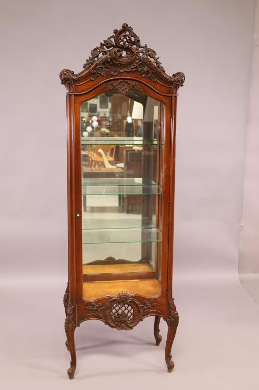 1940'S FRENCH STYLE CURIO CABINET: CARVED SINGLE DOOR MIRRORED BACK CURIO CABINET WITH THREE INTERIOR GLASS SHELVES, NO KEY. IN OVERALL GOOD CONDITION. 24" X 14" X 72". THIS ITEM EXCEEDS SIZE LIMITATIONS FOR IN HOUSE SHIPPING.