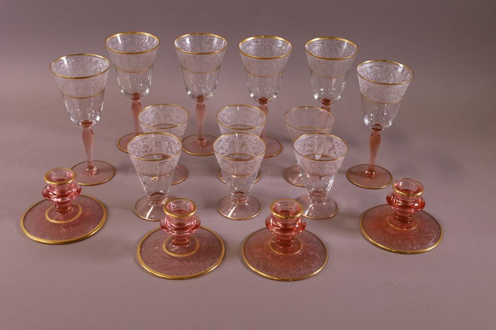 16 PIECES OF GLASTONBURY GLASSWARE: GLASTONBURY LOTUS ROSE GLASSWARE. SIX 7.5" WINE GLASSES, SIX 4.5" GLASSES, AND FOUR CANDLE STICKS.