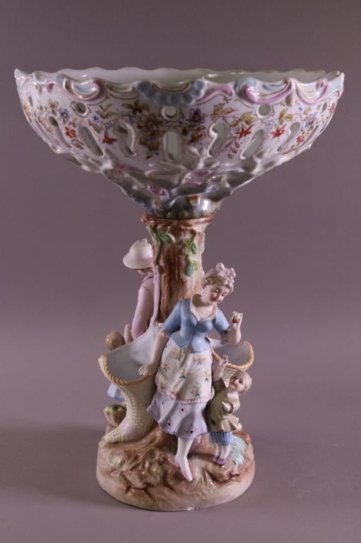 FRENCH BISQUE COMPOTE: 2 PIECE FIGURAL FRENCH BISQUE COMPOTE, SIGNED ON BASE. SMALL CHIP TO BASE. 11 1/2" DIAM x 15" H.