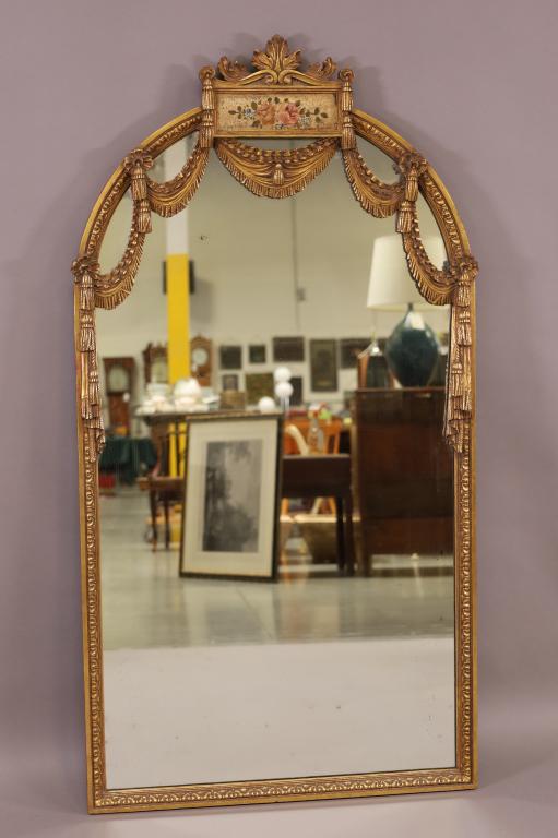 GILT WOOD DECORATED WALL MIRROR: HAND PAINTED FLORAL DECORATED. MINOR SILVER DAMAGE TO MIRROR. 28" W x 54" H. THIS ITEM EXCEEDS SIZE LIMITATIONS FOR IN HOUSE SHIPPING.