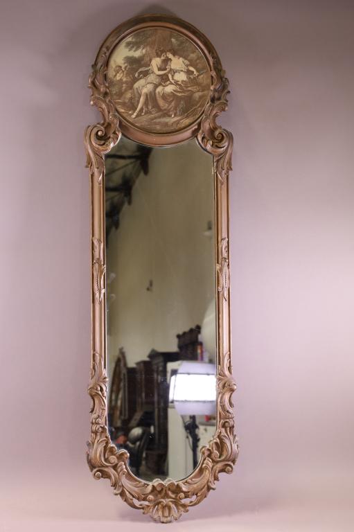 1920'S TRUMEAU WALL MIRROR: 1920'S WALL MIRROR WITH VICTORIAN PRINT IN UPPER PORTION. GOOD CONDITION. 43" H. THIS ITEM EXCEEDS SIZE LIMITATIONS FOR IN HOUSE SHIPPING.