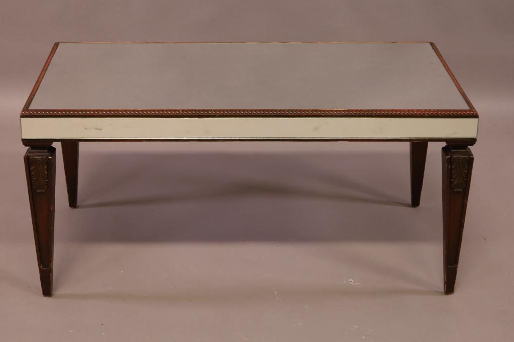 MIRRORED COFFEE TABLE: MAHOGANY ROPE TWIST EDGE, MIRRORED TOP AND SIDES. MINOR WEAR TO FINISH. 37" W x 21" D x 18" H. THIS ITEM EXCEEDS SIZE LIMITATIONS FOR IN HOUSE SHIPPING.